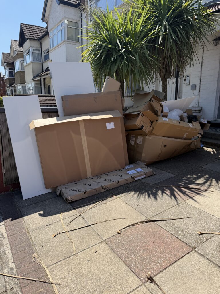 Before rubbish clearance in Highgate (N6) showing cardboard packaging and bulky waste ready for collection.